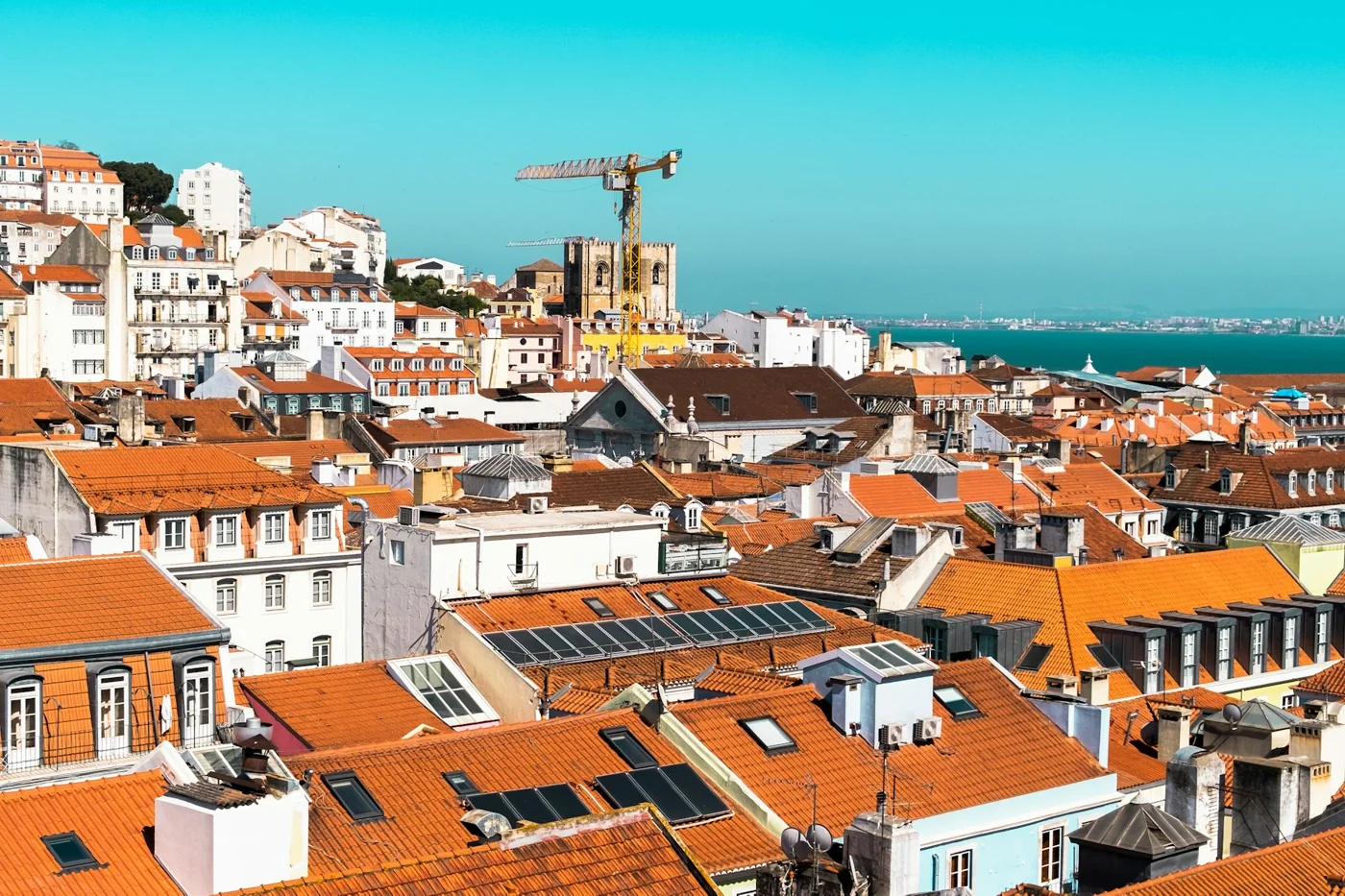 Terracotta rooftops of Lisbon overlooking the Tagus River